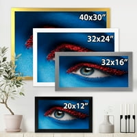 Designart 'Woman szem kék festékkel az arcon és a piros golyókon' Modern keretes művészeti nyomtatás